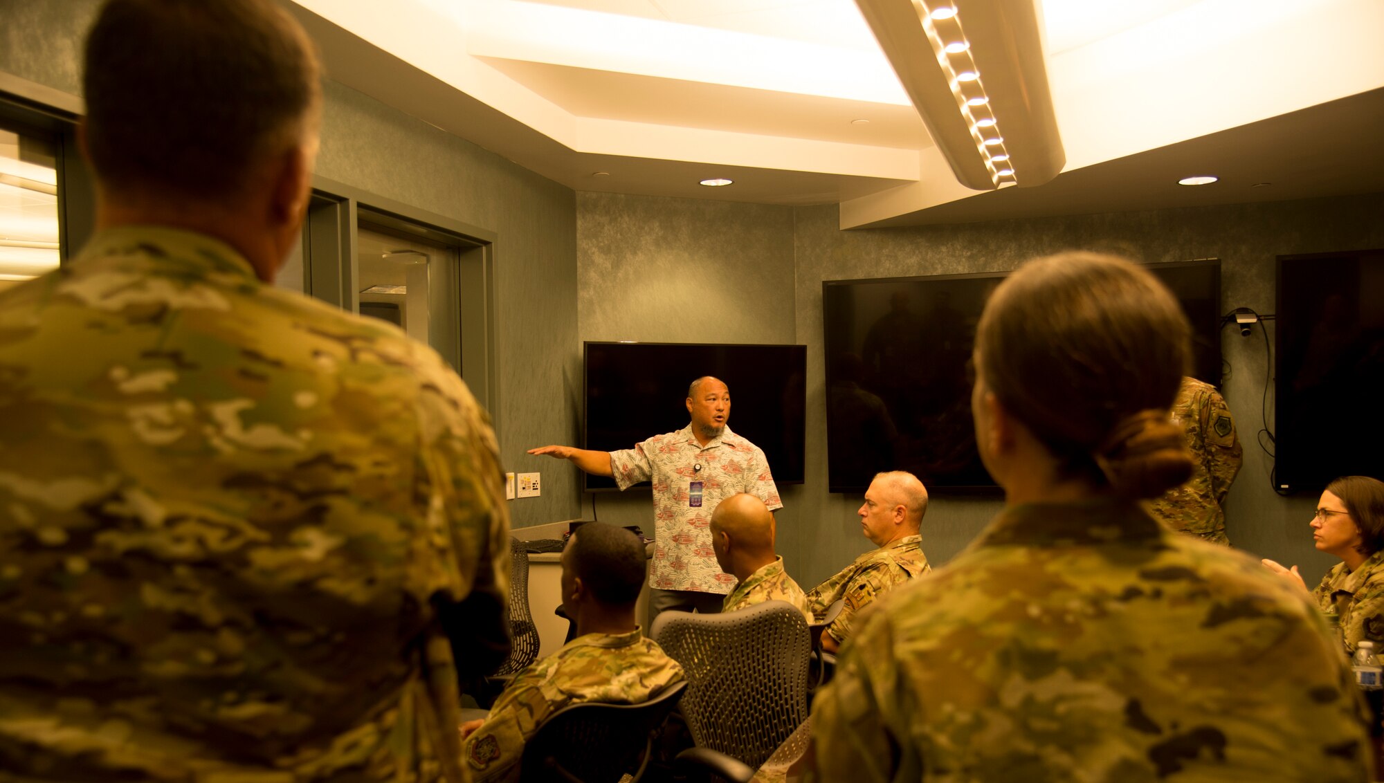 Kevin Saito, Hawaii Electric Company Systems Operations regional director, explains to U.S. Air Force Continuous Process Improvement Senior Leader Course participants how HECO is using CPI to make Hawaii energy independent by 2045 at the HECO headquarters Aug. 2, 2019. The HECO tour demonstrated to senior leaders how CPI can increase mission efficiency and effectiveness. (U.S. Air Force photo by 2nd Lt. Amber R. Kelly-Herard)