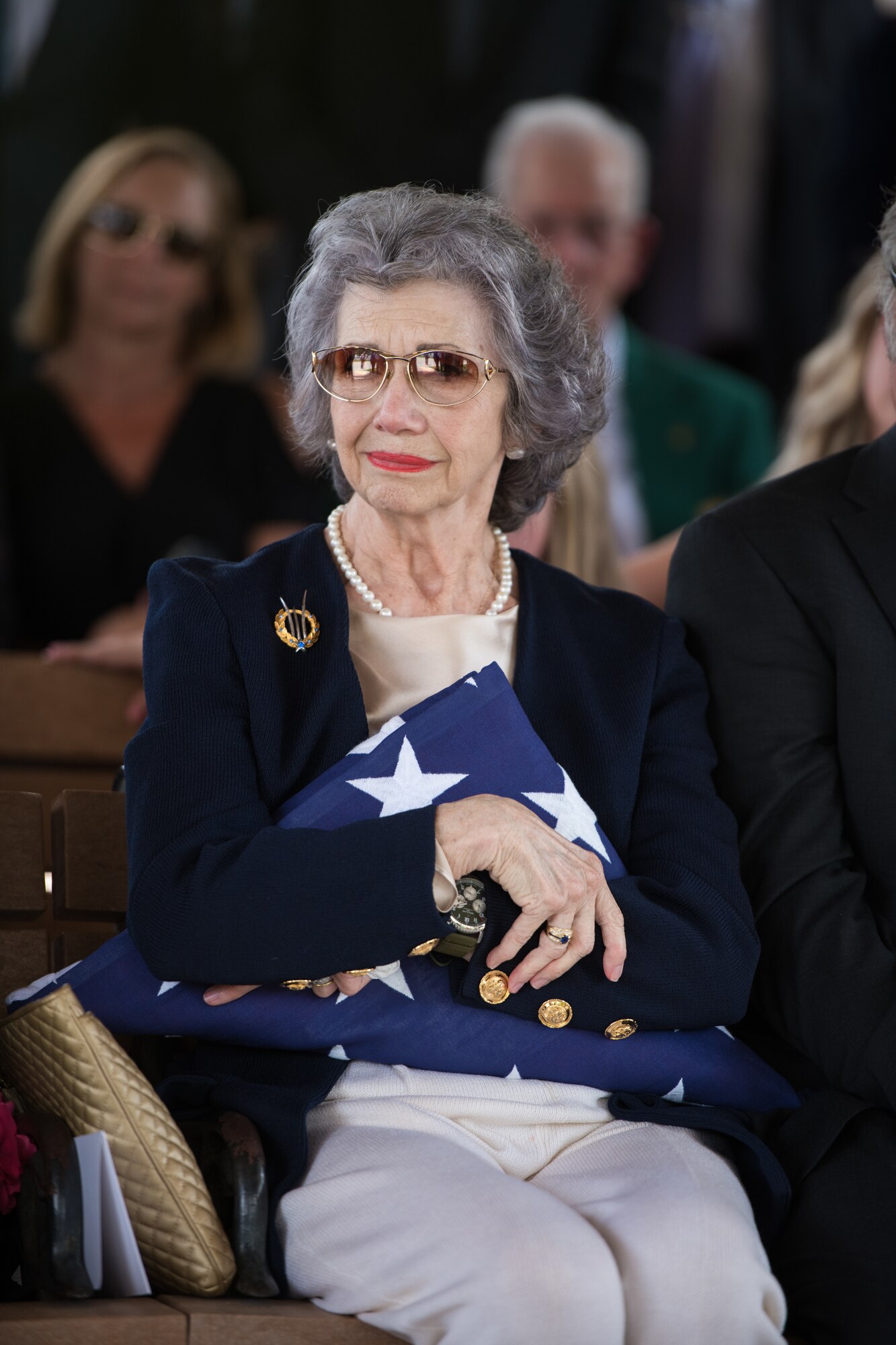 Nancy, surviving wife of Oliver "Ollie" Crawford, holds on to the flag presented to her during her husband's funeral ceremony Aug. 5, 2019, at Joint Base San Antonio-Fort Sam Houston, Texas. "Ollie" passed away at the age of 94, on Sunday, July 21, 2019 in San Antonio, Texas.