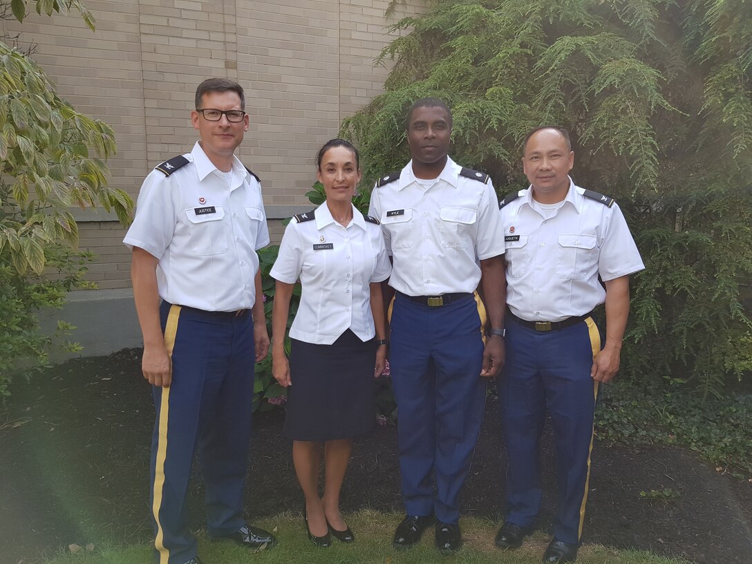 U.S. Army Reserve Col. Aaron Justice, commander of the 510th Regional Support Group, 7th Mission Support Command; Col. Betty Cummiskey, deputy commanding officer for the 361st Civil Affairs Brigade, 7th MSC; Lt. Col. Clifton Kyle, commander of the 457th Civil Affairs Battalion, 361st CA BDE, 7th MSC; and Col. Ed Jugueta, assistant chief of staff G4, 7th MSC, pose for a photo outside the U.S. Army War College in Carlisle Barracks, Pennsylvania, on July 26, 2019. Five 7th MSC officers graduated the two-year program with a Master's degree in Strategic Studies.