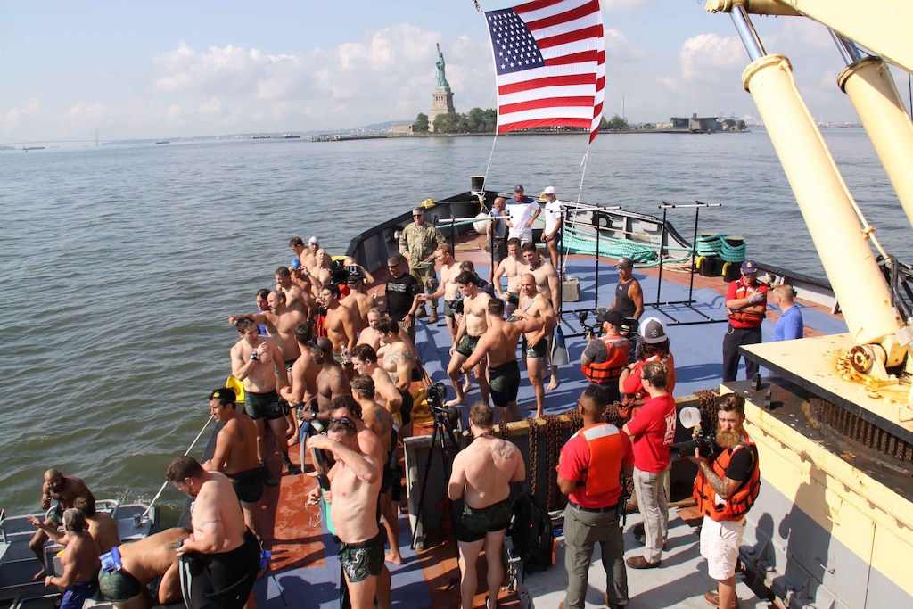 Assembled on the bow of the Army Corps vessel HAYWARD, 35 former and active members of the U.S. Navy SEAL during ‘Hudson River Swim’ charity event.