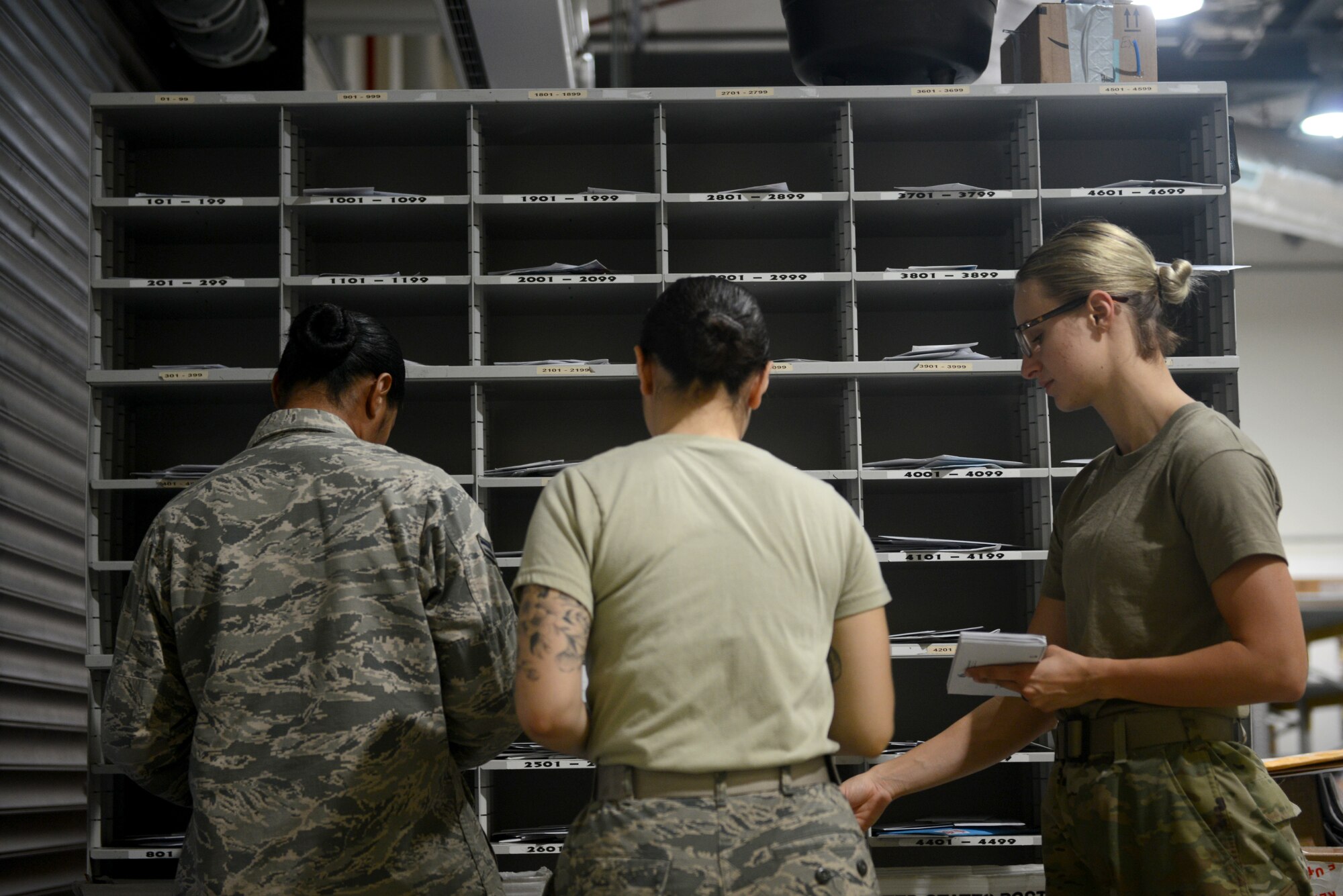 U.S. Air Force Airmen from the 31st Force Support Squadron sort mail, Aug. 2, 2019, at Aviano Air Base, Italy. The 31st FSS is the 31st Fighter Wing's largest and most diverse squadron, comprised of more than 600 military and civilian personnel whose primary mission is to enhance combat capability, readiness, and quality of life for a community of nearly 10,000 military members, DoD civilians, local national employees, and dependents. (U.S. Air Force photo by Airman 1st Class Ericka A. Woolever)