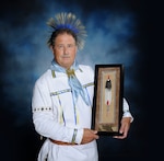 Edward Blauvelt poses in his American Indian regalia for a photo at the 502nd Air Base Wing public affairs office. Blauvelt was recently presented the 2019 Society of American Indians Government Employees Meritorious Service Award.