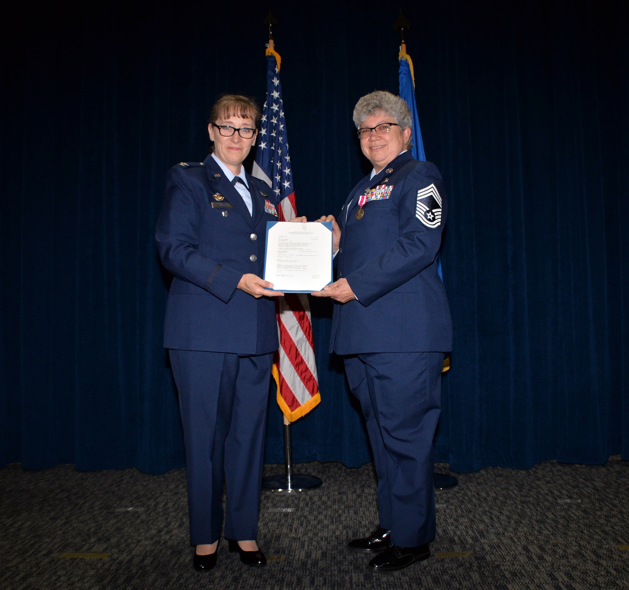 Col. Lisa M. Craig, Air Force Reserve Command director of manpower, personnel, and services, presented the retirement order to Chief Master Sgt. Debra L. Kelly, 74th Aerial Port Squadron chief enlisted manager, upon the occasion of her retirement Aug. 3, 2019 at Joint Base San Antonio-Lackland, Texas.