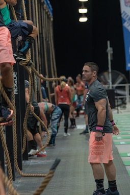 Lt. Col. Anthony Kurz, a member of the U.S. Army Warrior Fitness Team assigned to the Asymmetric Warfare Group in Fort Meade, Md., competes in the Men's Masters (40-44) Division at the 2019 CrossFit Games in Madison, Wis., Aug. 3, 2019. During his second event, Kurz had to complete three rope climbs 15 front squats, and 60 double-unders over five rounds for time. (Photo Credit: Devon L. Suits)