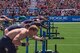 Capt. Chandler Smith, a member of the U.S. Warrior Fitness Team, competes in the men's individual competition at the 2019 CrossFit Games in Madison, Wis., Aug. 2, 2019. During the fourth round, Smith had to complete a 172-foot sled push, 18 bar muscle-ups, and another 172-foot sled push to the finish line in under six minutes. (Photo Credit: Devon L. Suits)