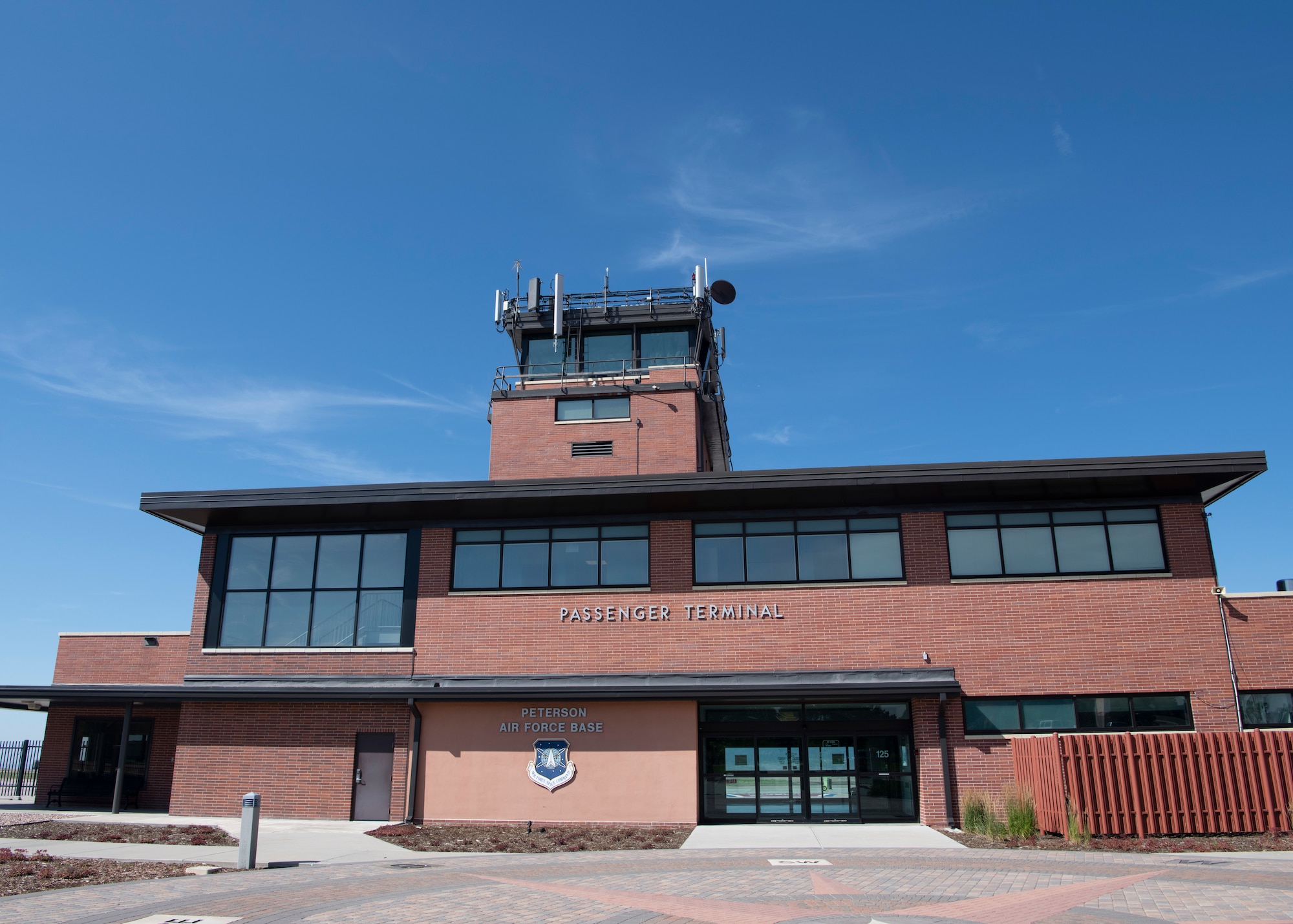 The passenger terminal provides access to the base’s flight line July 30, 2019, at Peterson Air Force Base, Colorado. It is the hub for all movement of personnel and cargo to and from the base and was recently named the best small air terminal in the Air Force. (U.S. Air Force photo by Heather Heiney)