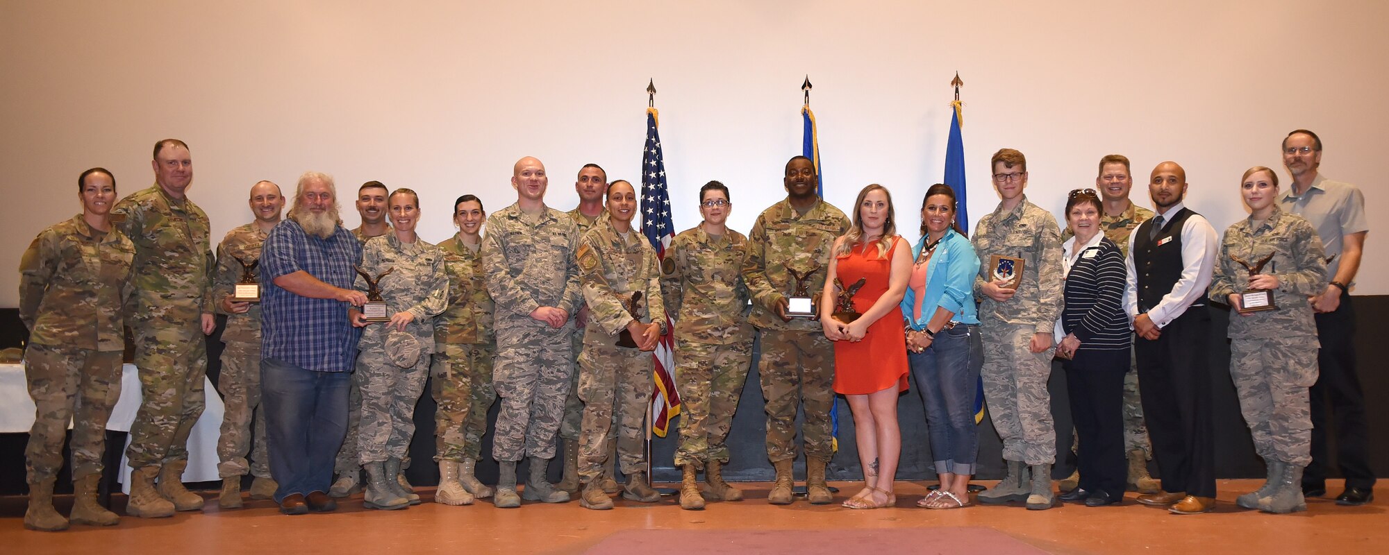 Col. Peter Bonetti, 90th Missile Wing commander, and Chief Master Sgt. Tiffany Bettisworth, 90th Missile Wing command chief, pose with the wing’s second quarter award winners at F.E. Warren Air Force Base, Wyo., Aug. 2, 2019. The wing held a celebration for all the nominees and presented the awards to the winners during a ceremony. (U.S. Air Force photo by Glenn S. Robertson)