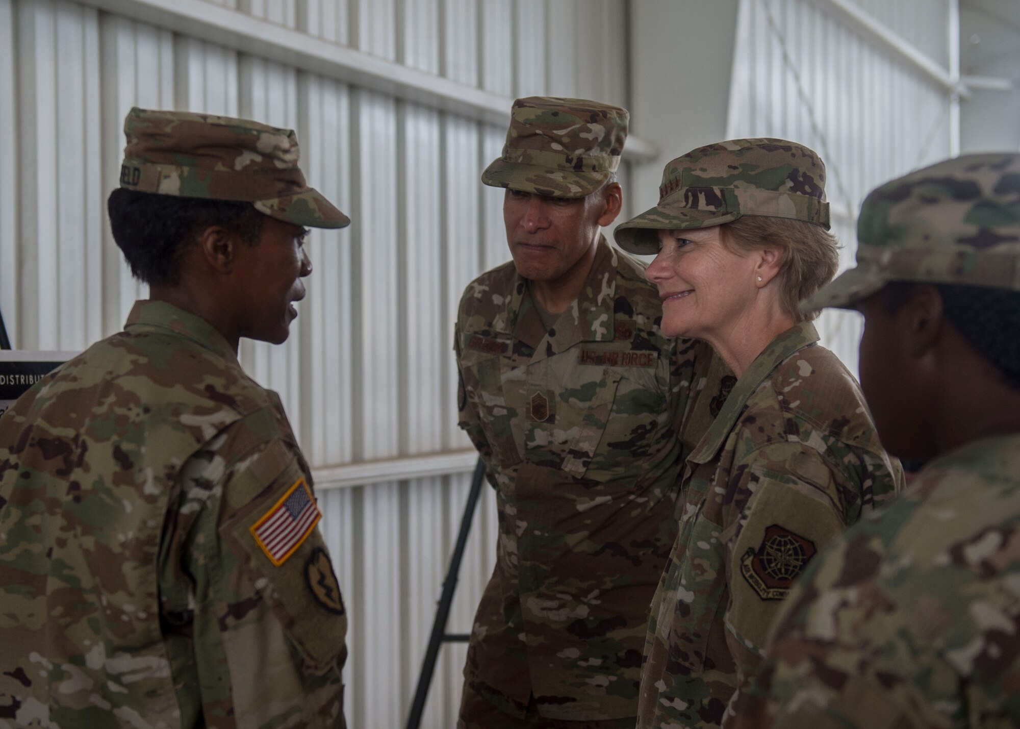 U.S. Army Lt. Col. Altwan Whitfield, left, commander of the 841st Transportation Battalion, gives a mission brief to Gen. Maryanne Miller, right, commander of Air Mobility Command, and Chief Master Sgt. Terrence Greene, AMC command chief master sergeant, center, during a visit to the Joint Base Charleston Naval Weapons Station, South Carolina, July 30, 2019. Miller and Greene visited JB Charleston July 29 to August 1 to get a first-hand look at mission capabilities, new innovative programs and how JB Charleston is taking care of its service members to build a stronger mobility force.  The 841st Trans. Bn.  conducts surface distribution and port clearance operations in support of combatant commanders and deployment readiness.