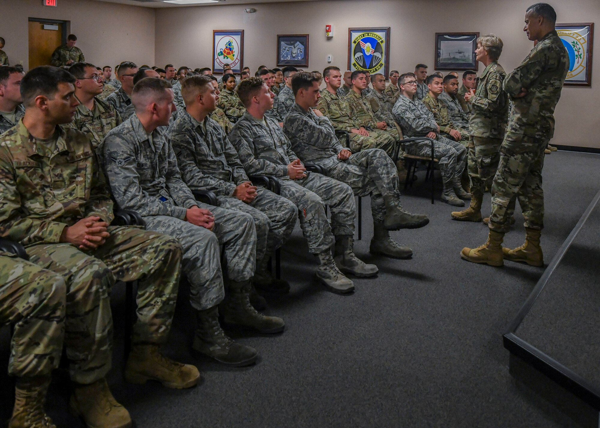 Gen. Maryanne Miller, commander of Air Mobility Command, and Chief Master Sgt. Terrence Greene, AMC command chief master sergeant, speak to junior enlisted members of the 437th Maintenance Group during a visit to Joint Base Charleston, South Carolina, July 31, 2019. Miller and Greene visited JB Charleston July 29 to August 1 to get a first-hand look at mission capabilities, new innovative programs and how JB Charleston is taking care of its service members to build a stronger mobility force.  New innovative programs being implemented on base include a summer intern program, a centralized fitness improvement program and a Child Development Center program to expand infant care options, as well as other programs to help improve quality of life and retain service members.