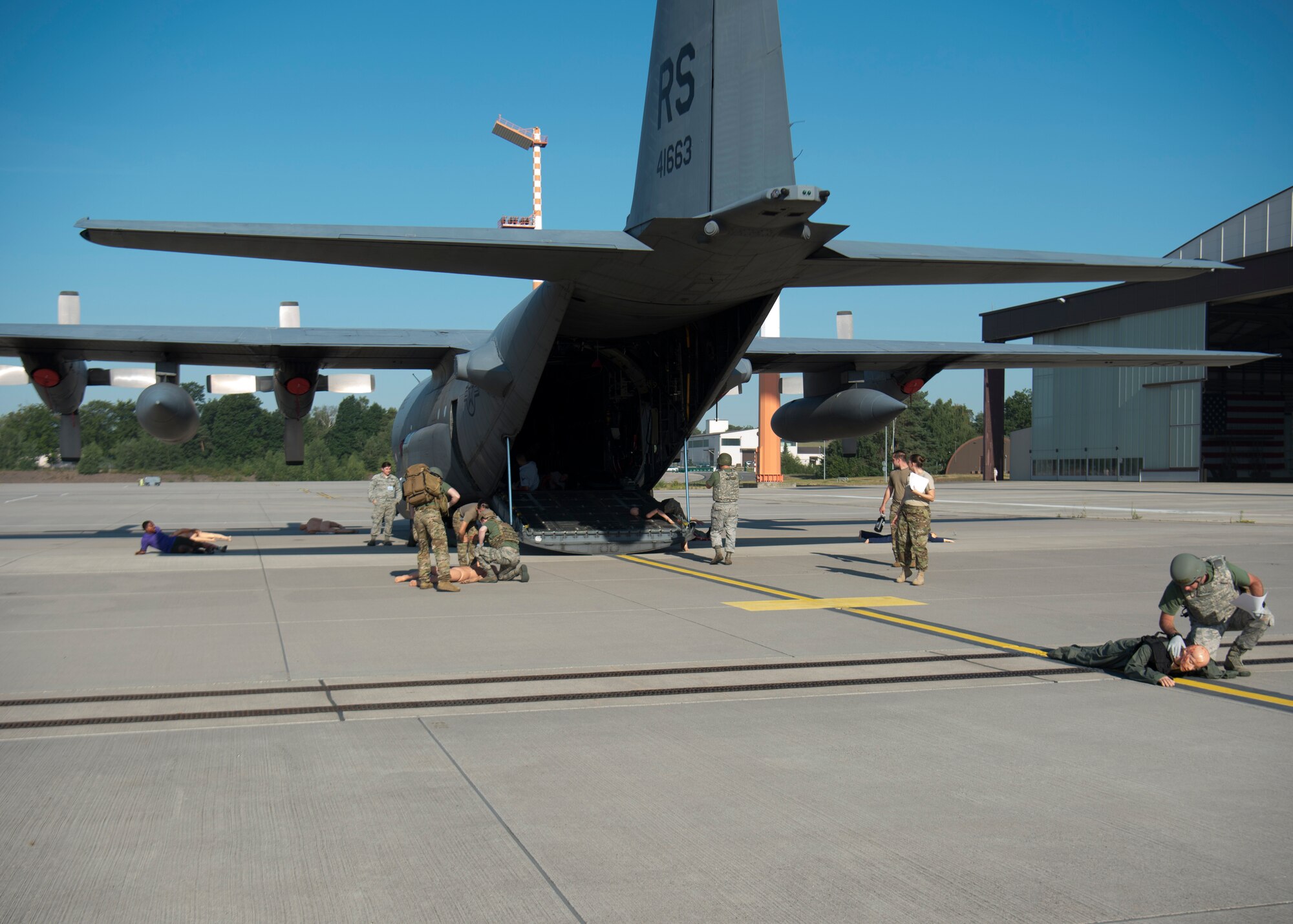 Medics respond to a simulated mass casualty scenario during the U.S. Air Forces in Europe EMT Rodeo at Ramstein Air Base, Germany, July 24, 2019. With only four team members and 30 victims, participants had to use their knowledge to evaluate which victims needed their immediate attention and which had non-life threatening injuries. (U.S. Air Force photo by Staff Sgt. Kirby Turbak)