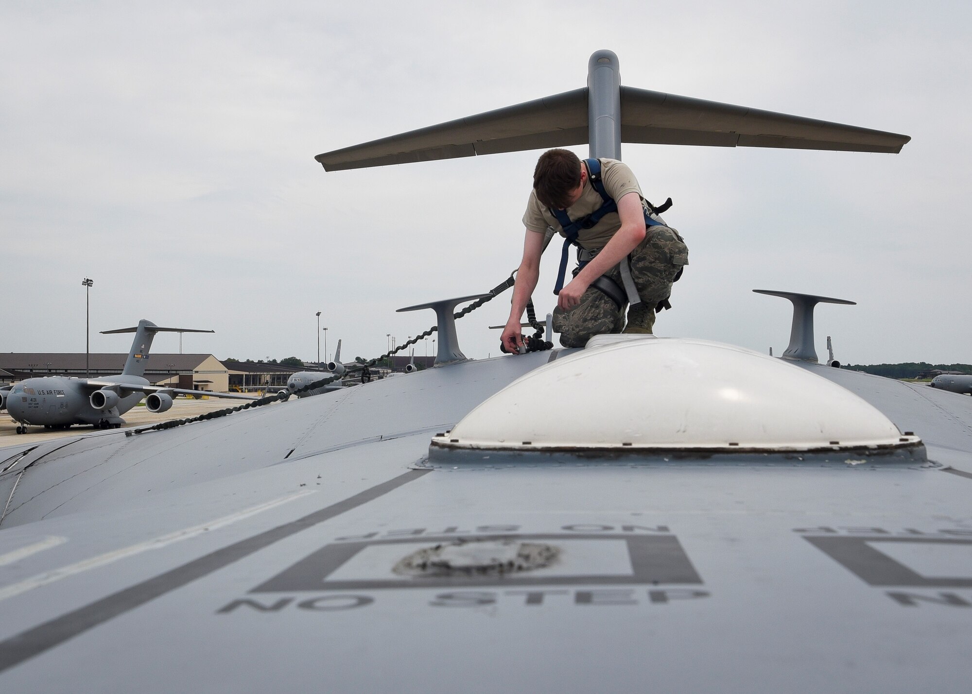 U.S. Air Force Airman 1st Class Chase Marlow, 305th Aircraft Maintenance Squadron crew chief, inspects a C-17 Globemaster to ensure there are no discrepancies prior to take-off at Joint Base McGuire-Dix-Lakehurst, New Jersey, August 2, 2019. Crew chiefs are able to maintain aircraft, support equipment, forms and records. (U.S. Air Force photo by Airman 1st Class Briana Cespedes)