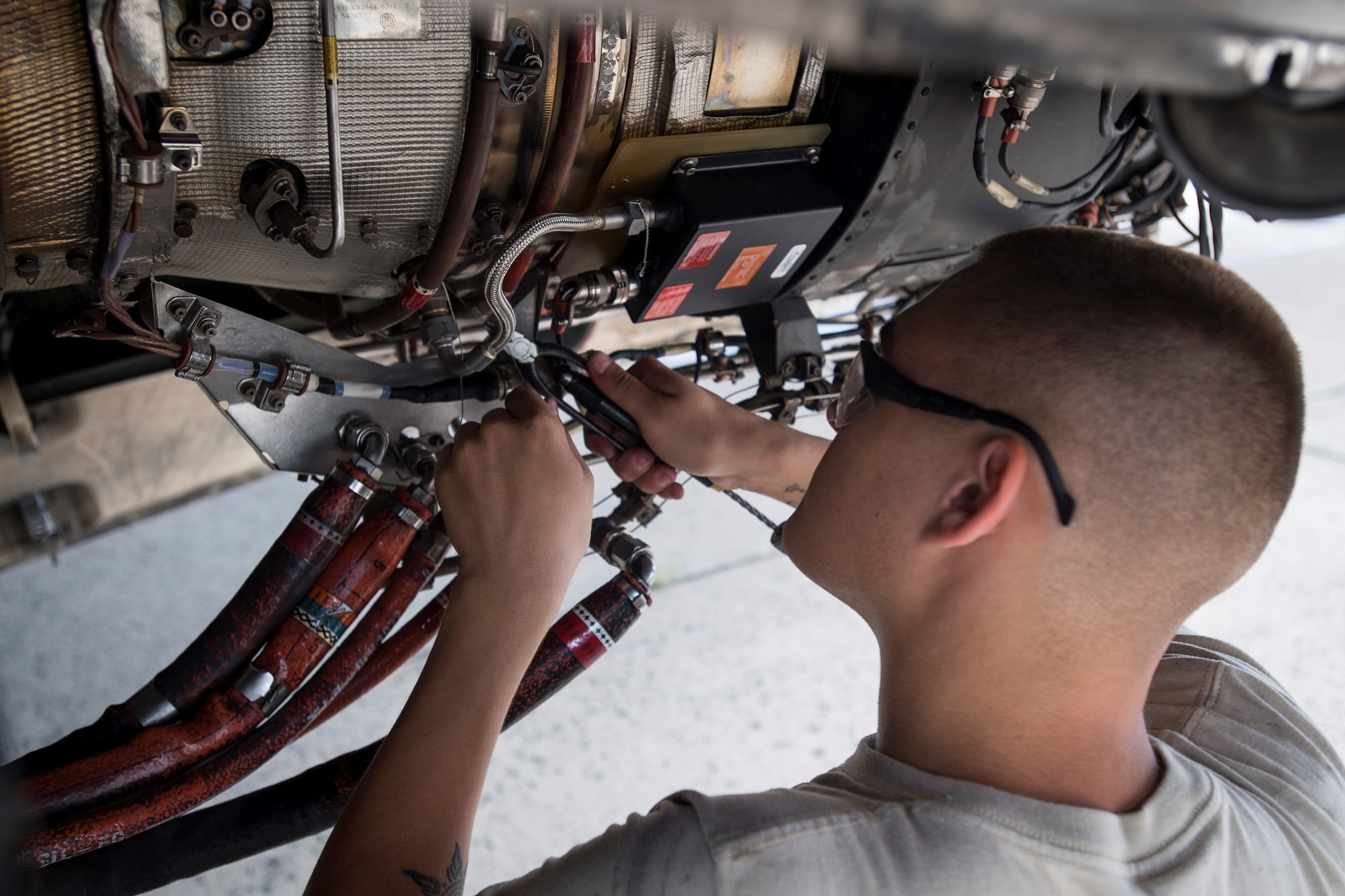 Airman 1st Class Nathaniel Canfield, 305th Aircraft Maintenance Squadron jet engine mechanic, installs new wiring inside of a C-17 Globemaster engine August 2, 2019 on Joint Base McGuire-Dix-Lakehurst, New Jersey. The 305th AMXS performs scheduled and unscheduled organizational-level maintenance for all transient and assigned C-17 aircraft. (U.S. Air Force photo by Senior Airman Jake Carter)