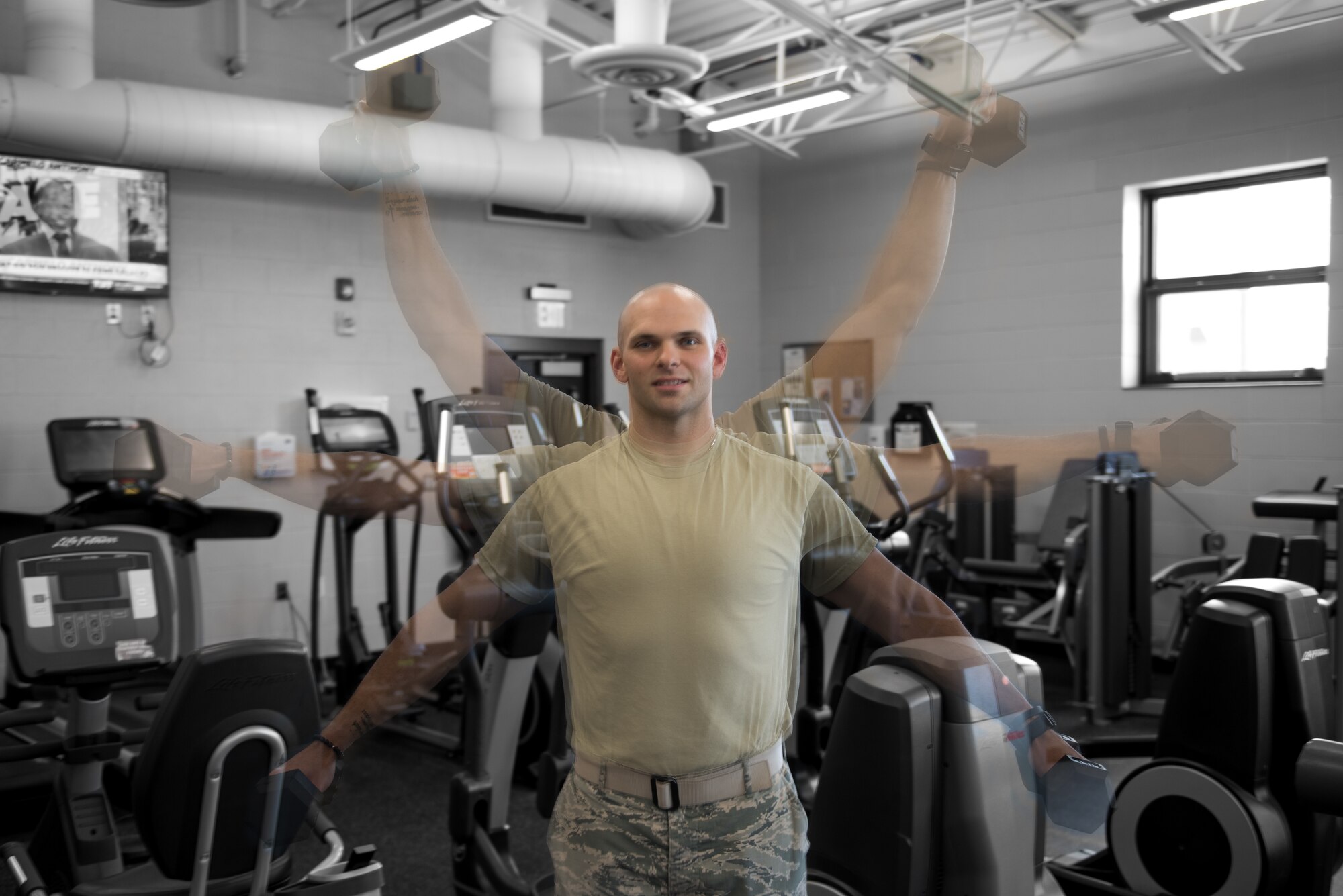 Airman 1st Class Adam Schuck, a services specialist with the 193rd Special Operations Force Support Squadron, Pennsylvania Air National Guard, performs a shoulder exercise