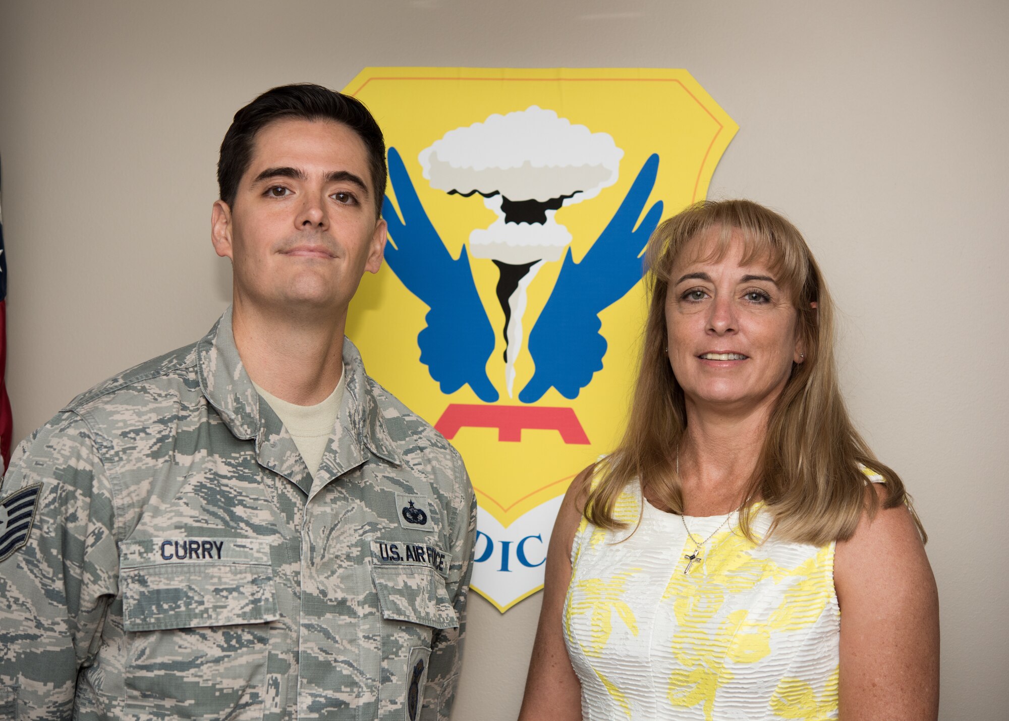 Second Lt. Christina Renkoski, a nurse with the U.S. Air Force Nurse Corps poses for a photo with her recruiter, Tech. Sgt. Mark Curry on July 22, 2019, at the 509th Medical Group Clinic at Whiteman Air Force Base, Missouri. Curry, an Air Force health professions recruiter with the 342nd Recruiting Squadron from Overland Park, Kansas, assisted Renkoski throughout her process to join the Air Force and rendered the first salute of her career. (U.S. Air Force Photo by Airman 1st Class Parker J. McCauley)