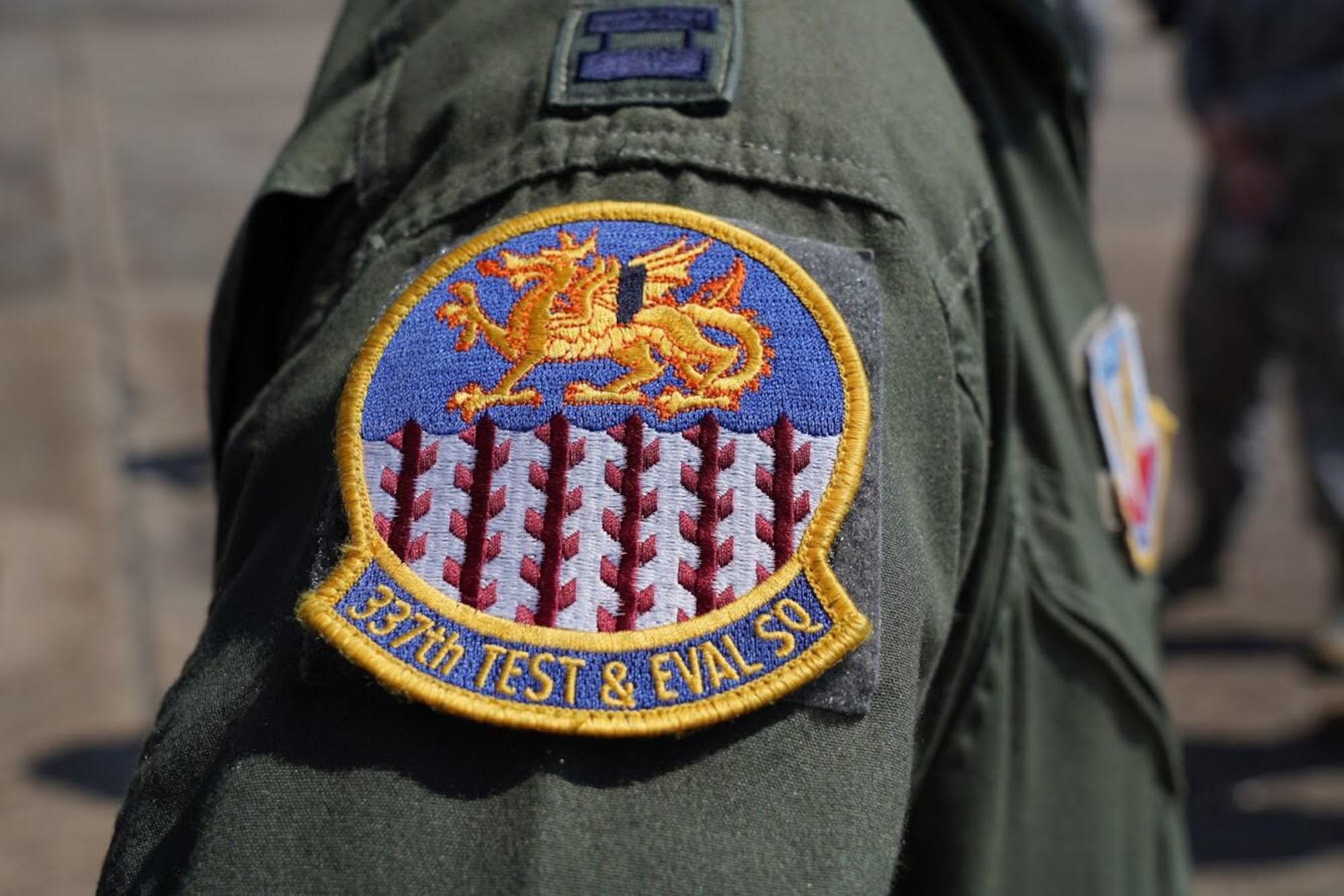 A pilot wears the patch of the 337th Test and Evaluation Squadron from Dyess AFB, Texas, during a tour on July 30, 2016 at Eglin Air Force Base, Fla. Aircrew brought the 53rd Wing bomber to allow wing personnel an opportunity to see one of their geographically separated aircraft up close. (U.S. Army photo/SGT Sean Hall)