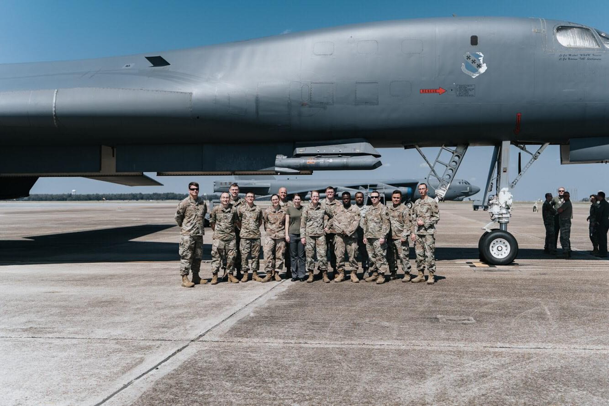 Airmen of the 16th Electronic Warfare Squadron stand in front of a B1-B Lancer at the conclusion of the tour on July 30, 2016 at Eglin Air Force Base, Fla. Aircrew brought the 53rd Wing bombers to allow wing personnel an opportunity to see one of their geographically separated aircraft up close. (U.S. Army photo/PFC Aaron Shaeper)