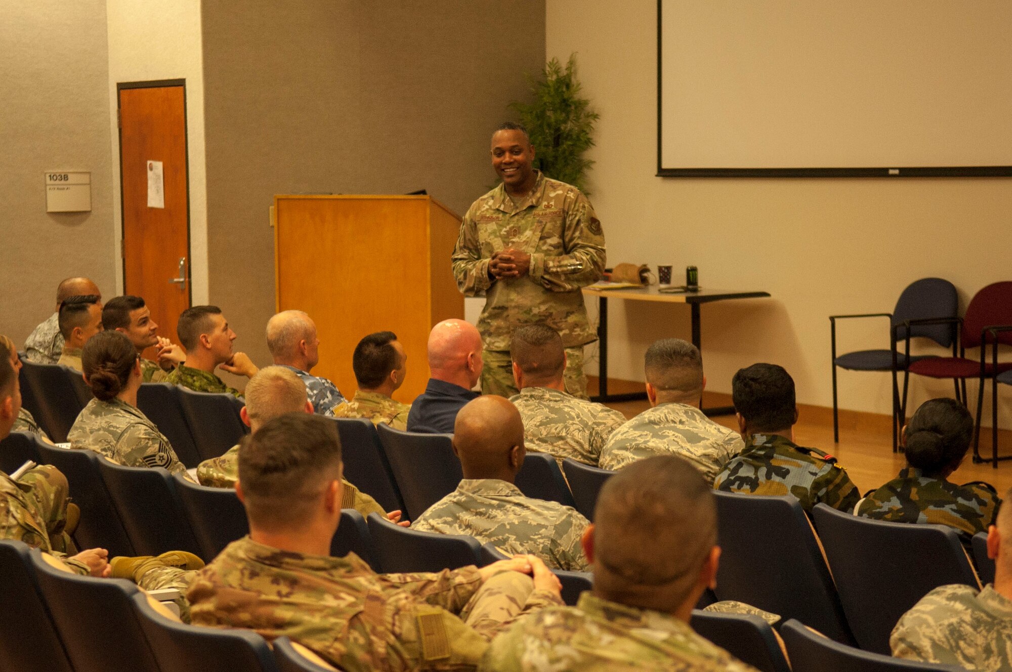 Chief Master Sgt. Anthony Johnson, U.S. Pacific Air Forces command chief, speaks to Airmen and international partners during a First Sergeants Symposium at Joint Base Pearl Harbor-Hickam, Hawaii, July 24, 2019. The five-day course included training provided by Air University, the First Sergeant Academy, and informational briefings from base helping agencies. 
(U.S. Air Force photo by Staff Sgt. Mikaley Kline)