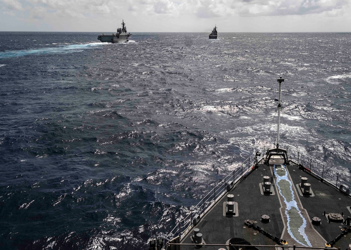 CORAL SEA (August 01, 2019) – The amphibious dock landing ship USS Ashland (LSD 48) sails behind the Japan Maritime Self-Defense Force (JMSDF) destroyer helicopter ship JS Ise (DDH 182), left, and the JMSDF amphibious transport dock ship JS Kunisaki (LST 4003). Ashland, part of the Wasp Amphibious Ready Group, with embarked 31st Marine Expeditionary Unit, is operating in the Indo-Pacific region to enhance interoperability with partners and serve as a ready-response force for any type of contingency.