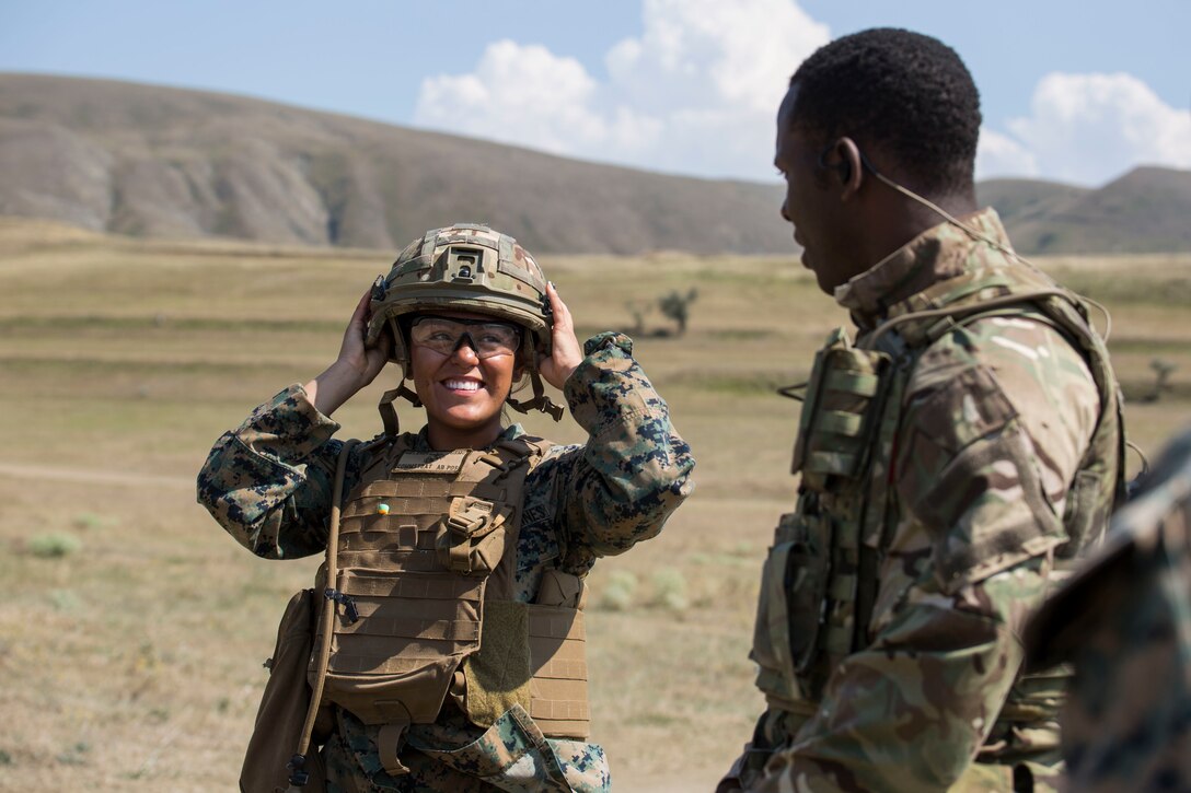 A U.S. Marine with Marine Rotational Force-Europe 19.2, Marine Forces Europe and Africa tries on a U.K. Army Kevlar during exercise Agile Spirit 2019 in Orpholo, Georgia, July 31, 2019.
