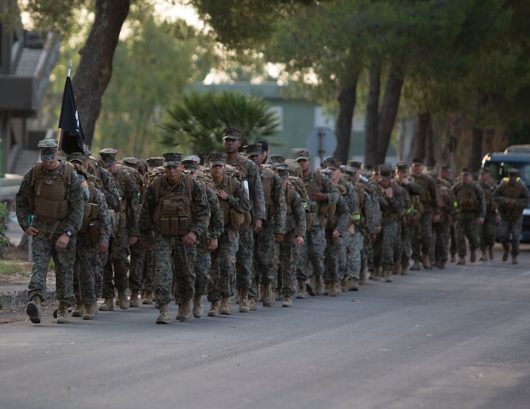 U.S. Marines with the logistics combat element of Special Purpose Marine Air-Ground Task Force-Crisis Response-Africa 19.2, Marine Forces Europe and Africa, conduct a 5 mile conditioning hike at Naval Air Station Sigonella, Italy, Aug. 3, 2019.