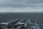 MANILA, Philippines (August 9, 2019) The aircraft carrier USS Ronald Reagan (CVN 76) anchors outside Manila, Philippines. Ronald Reagan is forward-deployed to the U.S. 7th Fleet area of operations in support of security and stability in the Indo-Pacific region.