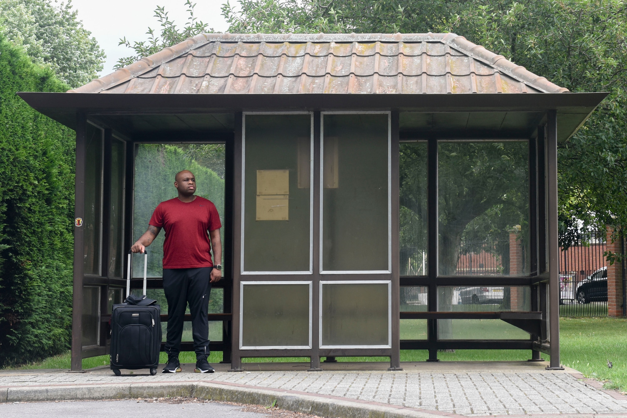 U.S. Air Force Tech. Sgt. Landon Scaife, 100th Air Refueling Wing Equal Opportunity advisor, waits for the bus to take him to the airport at RAF Mildenhall, England, Aug. 6, 2019. Scaife has visited more than 20 countries during his two assignments here. (U.S. Air Force photo by Airman 1st Class Joseph Barron)