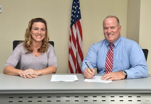 Jim LaBarre, 633rd Air Base Wing Inspector General director and Jennifer Ellis, 633rd ABW IG inspector, pose for a photo at the 633rd ABW IG office at Joint Base Langley-Eustis, VA, Aug. 5, 2019. LaBarre and Ellis talked about the importance of knowing how the IG can help U.S. Army Soldiers and Air Force Airmen. (U.S. Air Force photo by Airman 1st Class Sarah Dowe)