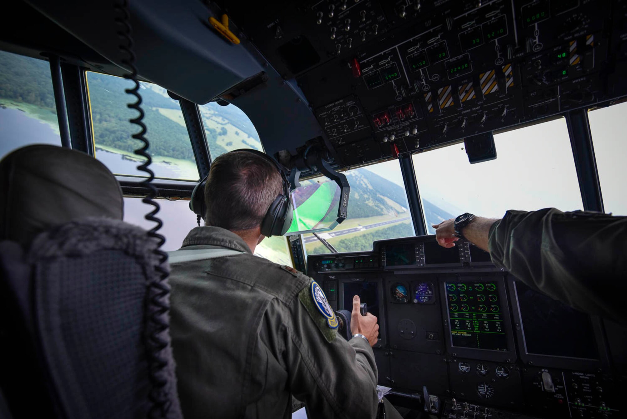 Maj. Seth Lake, 327th Airlift Squadron pilot, and Maj. Maj. Matthew Heisel, 327th Airlift Squadron pilot, participate in a training flight to enhance readiness on August 3, 2019, at Little Rock Air Force Base, Ark. The C-130 is a versatile aircraft that can be used for several different missions and the success of the mission depends upon teamwork and Airmen’s resiliency and their ability to overcome adversity. (U.S. Air Force photo by Senior Airman Nathan Byrnes)