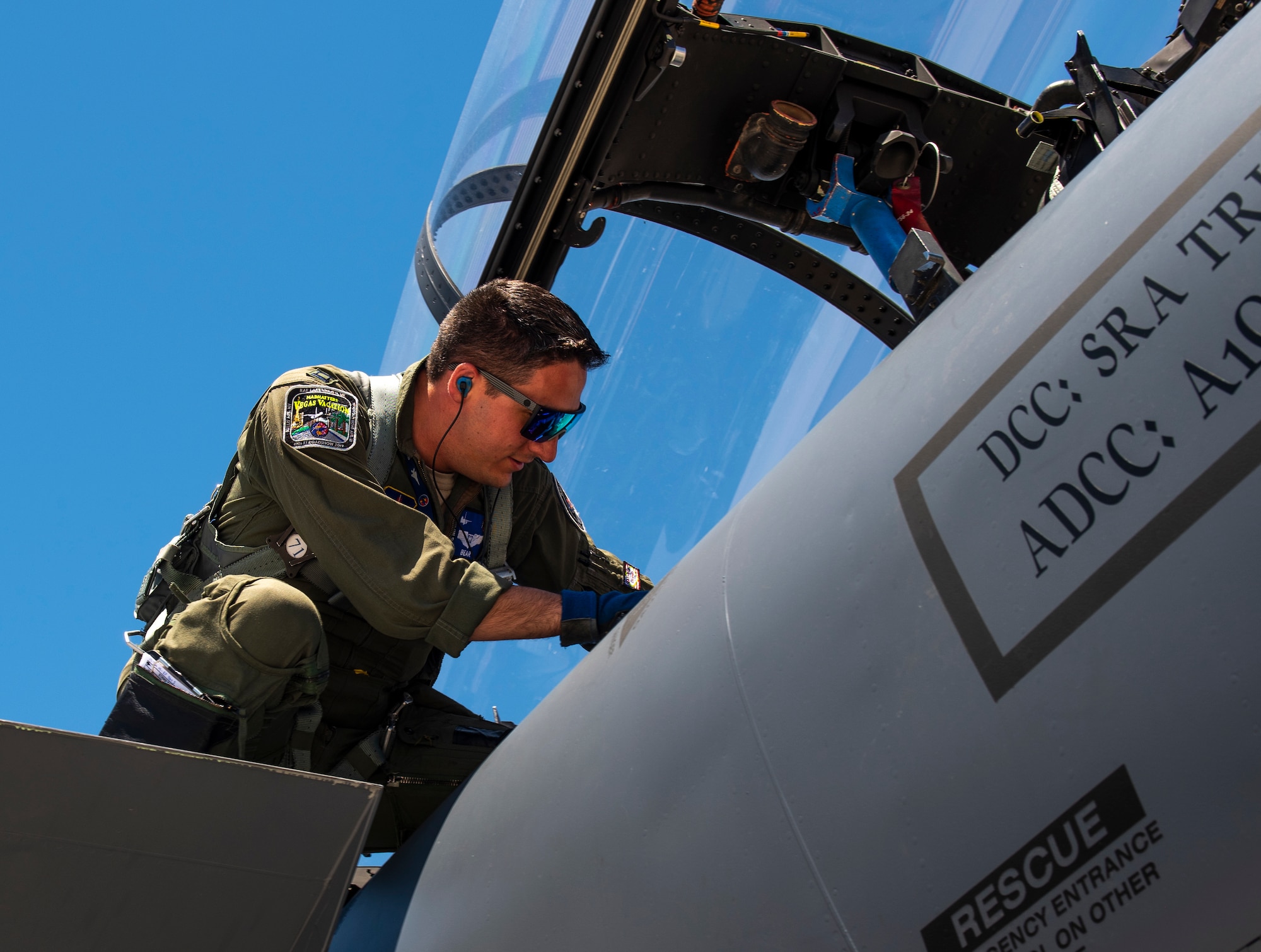 Capt. Samuel Wozniak enters an F-15E Strike Eagle.