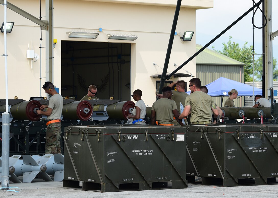 Airmen work to build munitions during CAPEX 2019 on Aug. 6, 2019, at Aviano Air Base, Italy. Exercises such as CAPEX keep the Airmen of the munitions career field prepared and demonstrates our ability to be rapidly ready for contingency operations. (U.S. Air Force photo by Airman 1st Class Caleb House)