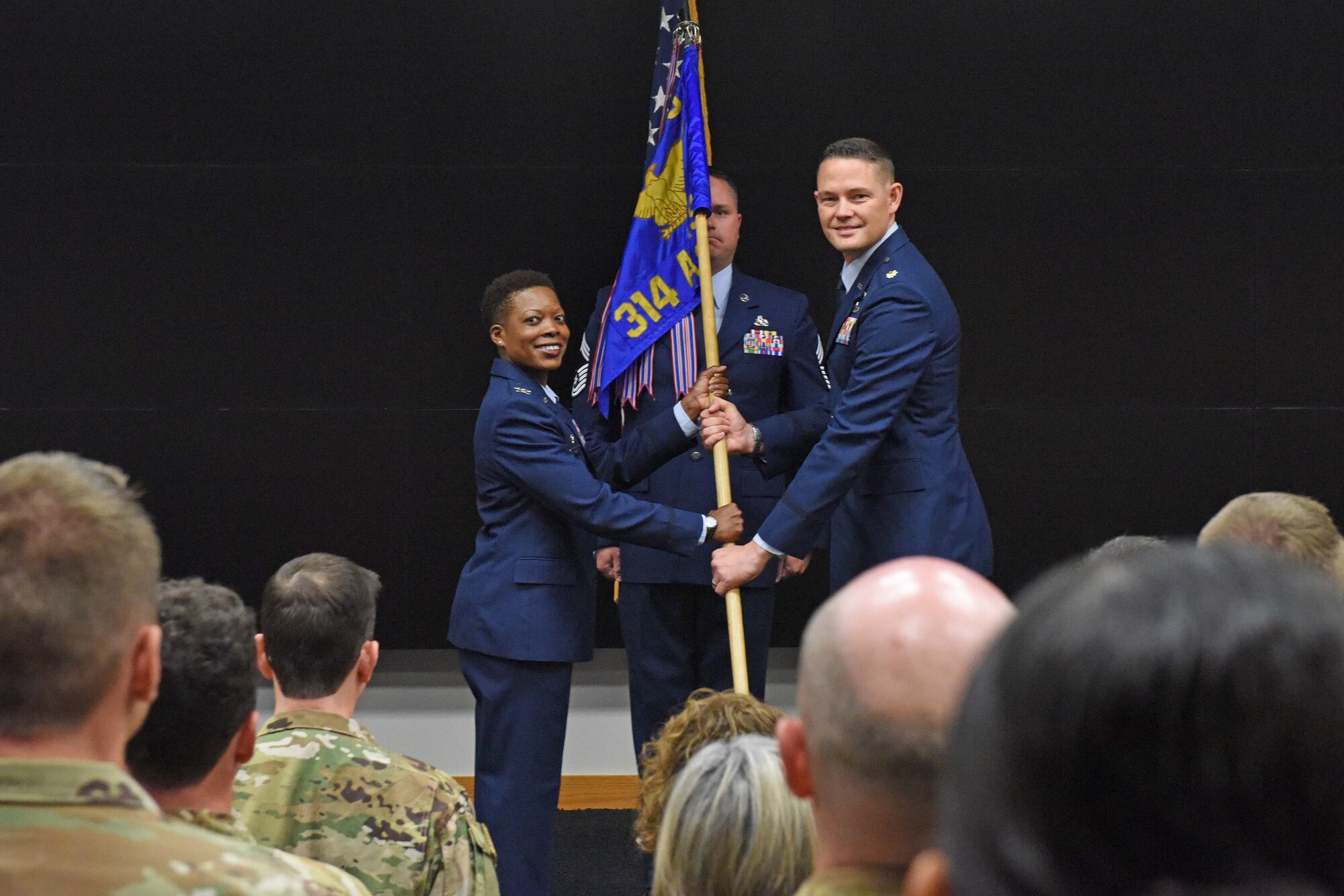 Two airmen change command during a ceremony