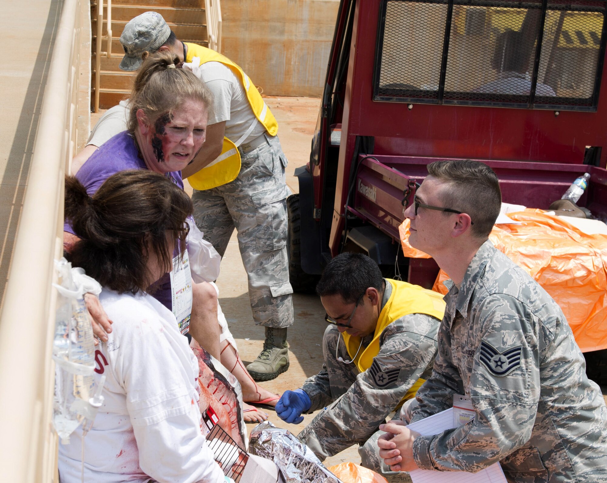 U.S. Air Force Staff Sgt. Robert Rogers, 20th Medical Group mental health technician, listens to two Team Shaw members during a mass casualty exercise at Shaw Air Force Base, South Carolina, Aug. 1, 2019.