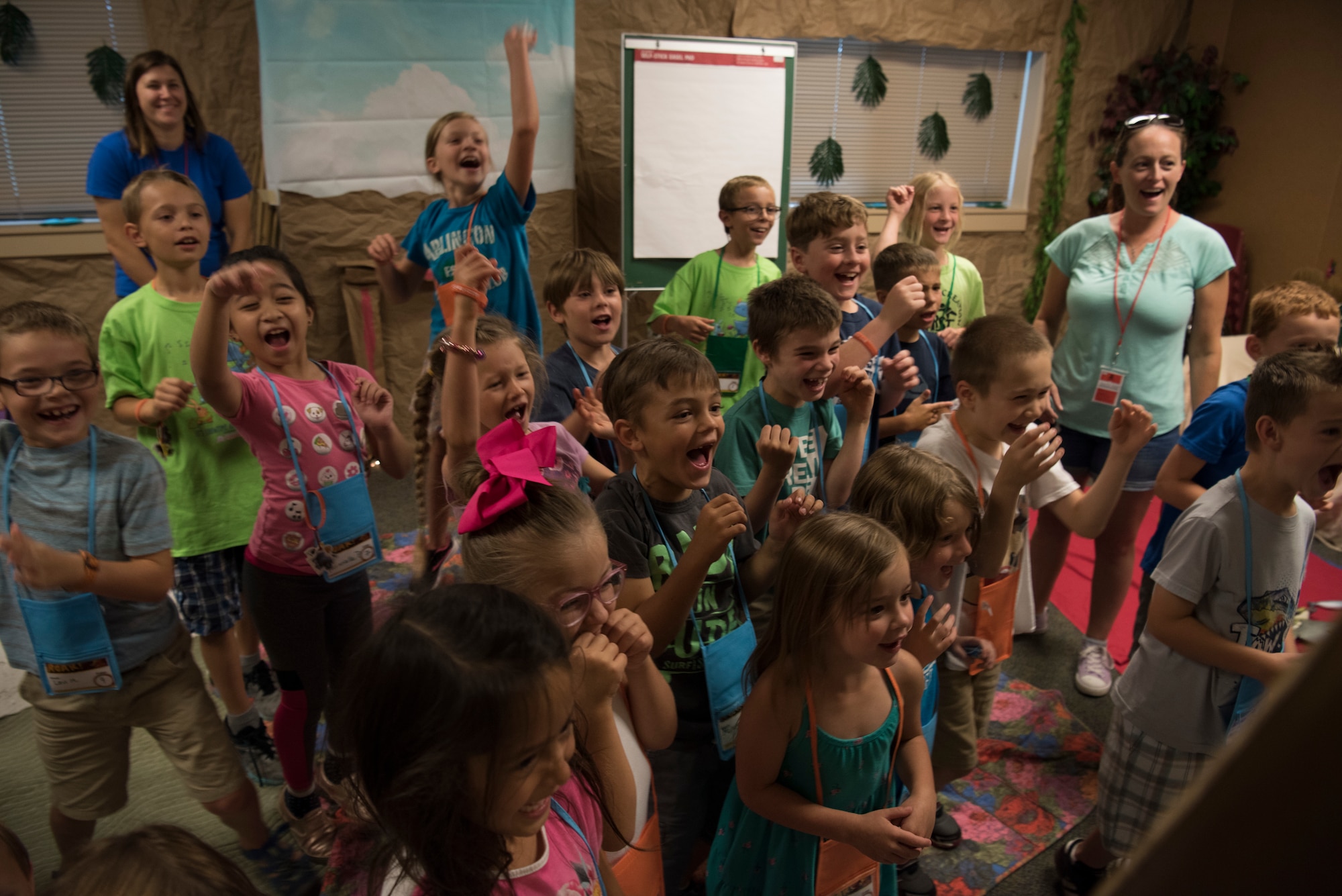 Children cheer during Vacation Bible School (VBS) August 6, 2019, at Mountain Home Air Force Base, Idaho. VBS is an annual event put on for youth to grow their faith and strengthen community relationships. (U.S. Air Force photo by Airman 1st Class Andrew Kobialka)