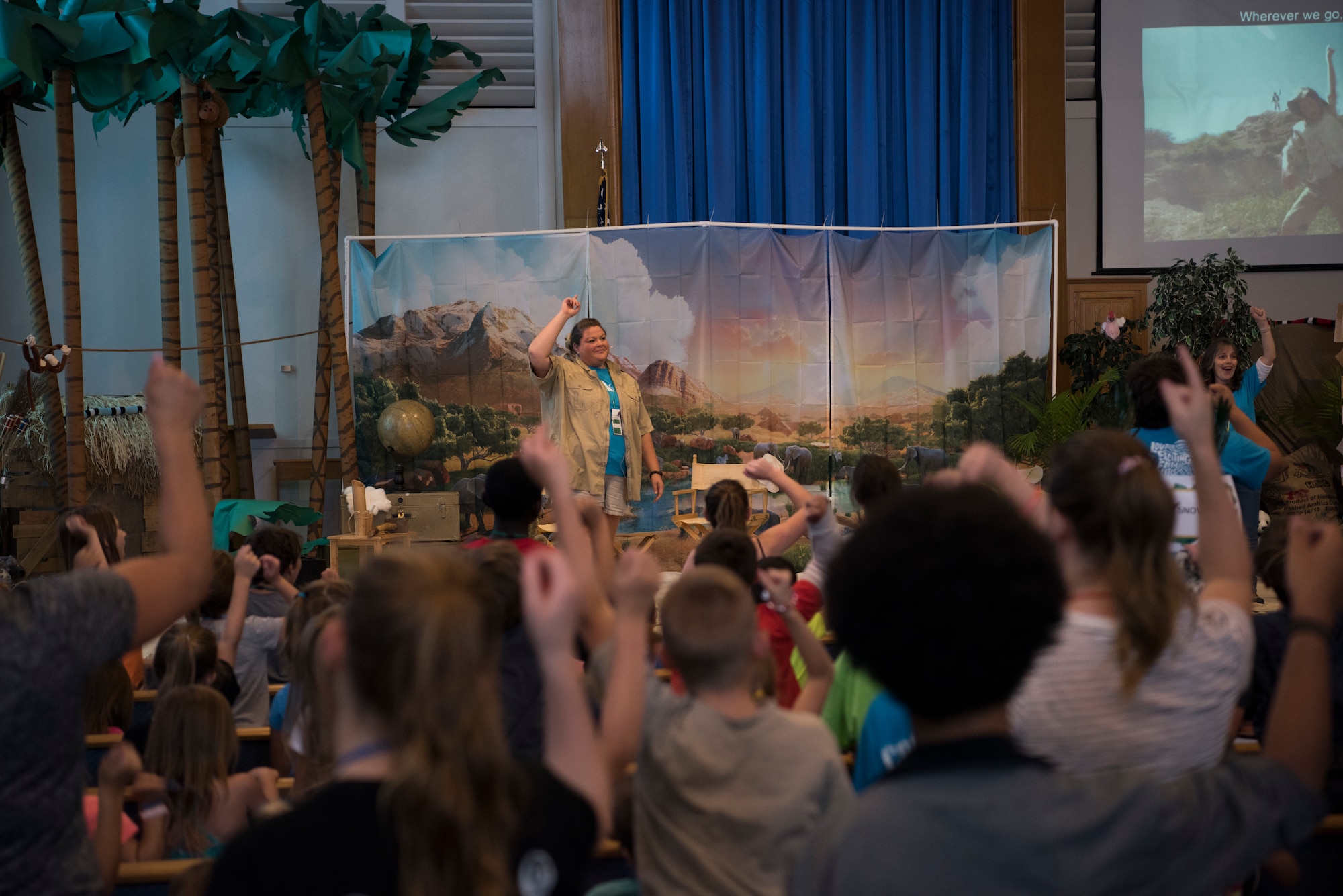 Kelly Gray, 366th Fighter Wing catholic religious coordinator, leads children in a song and dance during Vacation Bible School (VBS) August 6, 2019, at Mountain Home Air Force Base, Idaho. VBS is an annual event put on for youth to grow their faith and strengthen community relationships. (U.S. Air Force photo by Airman 1st Class Andrew Kobialka)
