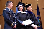 Maureen Baginski receives an honorary doctorate in strategic intelligence in recognition of her four decades of service to the nation. (Photo by Kathy Bowles, NIU)