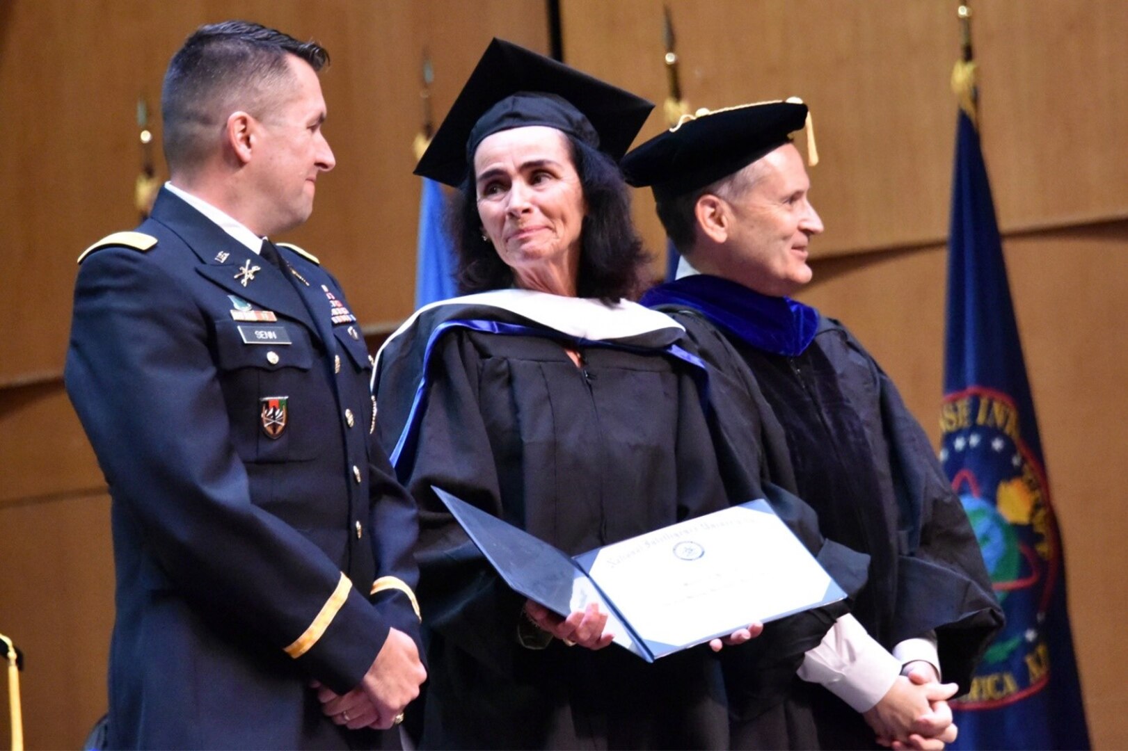 Maureen Baginski receives an honorary doctorate in strategic intelligence in recognition of her four decades of service to the nation. (Photo by Kathy Bowles, NIU)