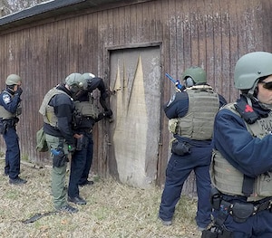 Officers work together on a training exercise.