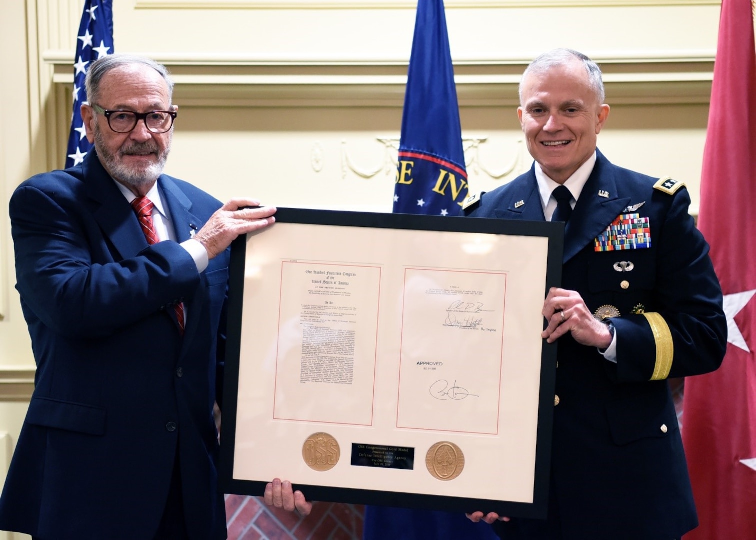 JOINT BASE ANACOSTIA-BOLLING, D.C. (July 31, 2019) Retired Lt. Gen. Patrick Hughes, serving as the Office of Strategic Service Society Representative, presenting the OSS Congressional Gold Medal to DIA Director Lt. Gen. Robert P. Ashley Jr. (DIA photo by David Richards/Released)