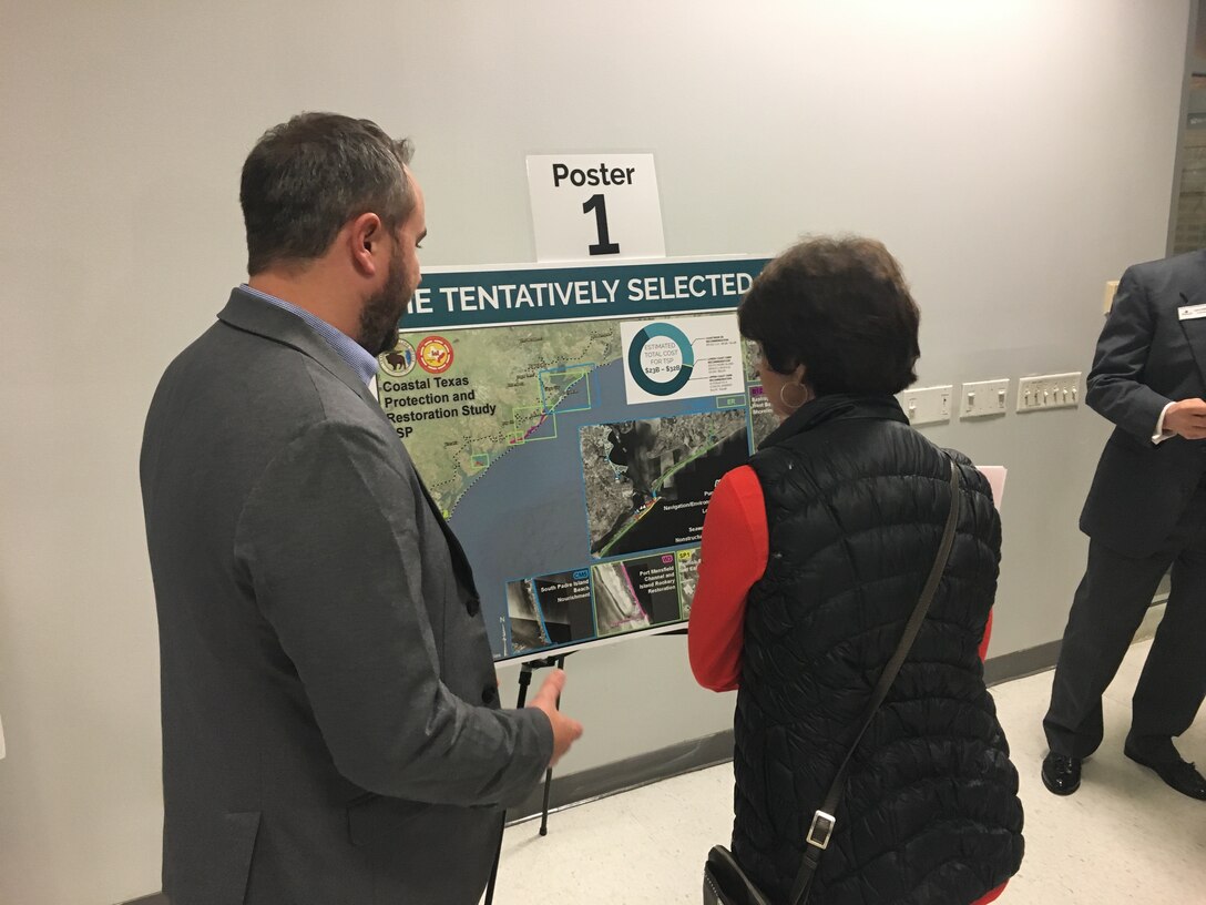 SEABROOK, Texas (December 18, 2018)—Dr. Paul Hamilton, hydraulic engineer with USACE Galveston District discusses the Coastal Texas Protection and Restoration Feasibility Study with a stakeholder during one of the public meetings for the Study. (Photo by USACE Galveston District)