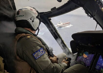 PACIFIC OCEAN (Aug. 6, 2019) Lt. Cmdr. Phillip Pretzinger from Dayton, Ohio, prepares to approach CSC Brave during a medical evacuation mission by the �Island Knights� of Helicopter Sea Combat Squadron (HSC) 25. The Guam-based �Island Knights� of Helicopter Sea Combat Squadron (HSC) 25 responded to a Chinese civilian in distress aboard the Chinese-flagged vessel in the Pacific, Aug. 6.