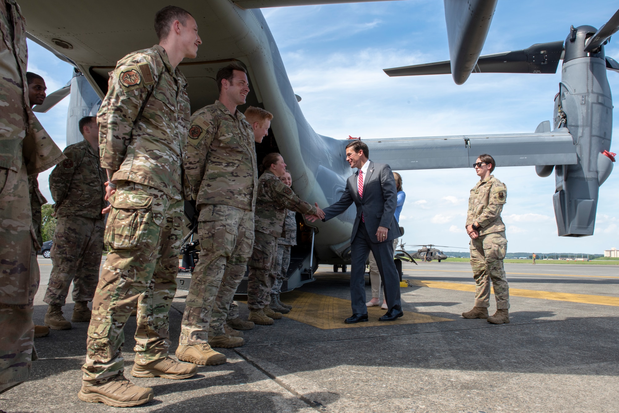 U.S. Secretary of Defense Dr. Mark T. Esper shakes hands with the Airmen of the 353rd Special Operations Group prior to departing Yokota Air Base, Japan to continue his Pacific Tour, Aug. 7, 2019.