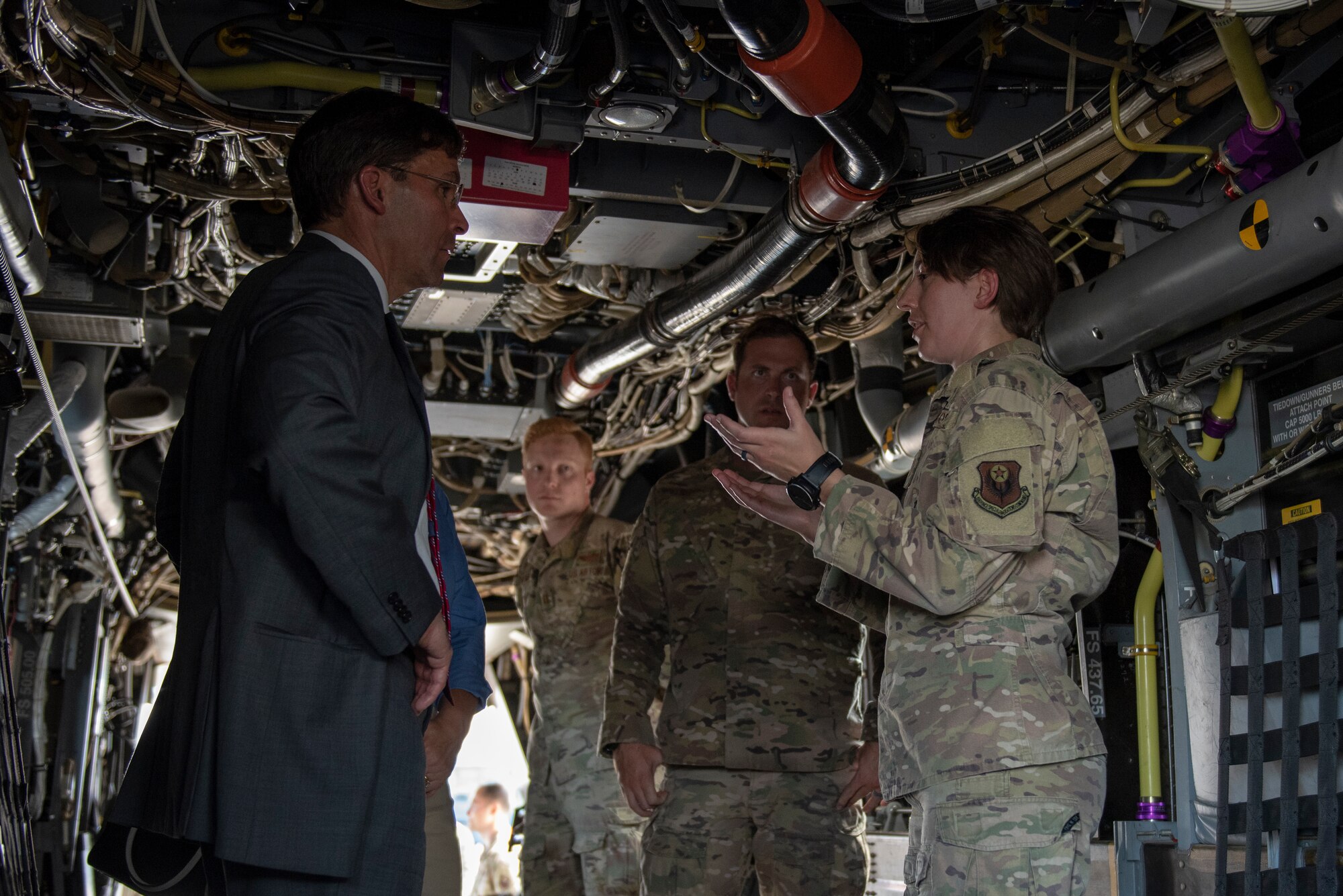 U.S. Air Force Capt. Laura Jones, 21st Special Operations Squadron flight commander, leads Secretary of Defense Dr. Mark T. Esper on a CV-22 Osprey tour at Yokota Air Base, Japan, Aug. 7, 2019