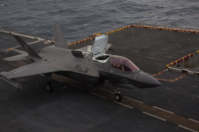 An F-35B Lightning II fighter aircraft with Marine Medium Tiltrotor Squadron 265 (Reinforced), 31st Marine Expeditionary Unit, loaded with a Joint Direct Attack Munition and a laser guided bomb, prepares to take off during an aerial gunnery and ordnance hot-reloading exercise aboard the amphibious assault ship USS Wasp (LHD 1), Solomon Sea, August 4, 2019. Wasp, flagship of the Wasp Amphibious Ready Group, with embarked 31st MEU, is operating in the Indo-Pacific region to enhance interoperability with partners and serve as ready-response force for any type of contingency, while simultaneously providing a flexible and lethal crisis response force ready to perform a wide range of military operations. (U.S. Marine Corps photo by Lance Cpl. Dylan Hess)