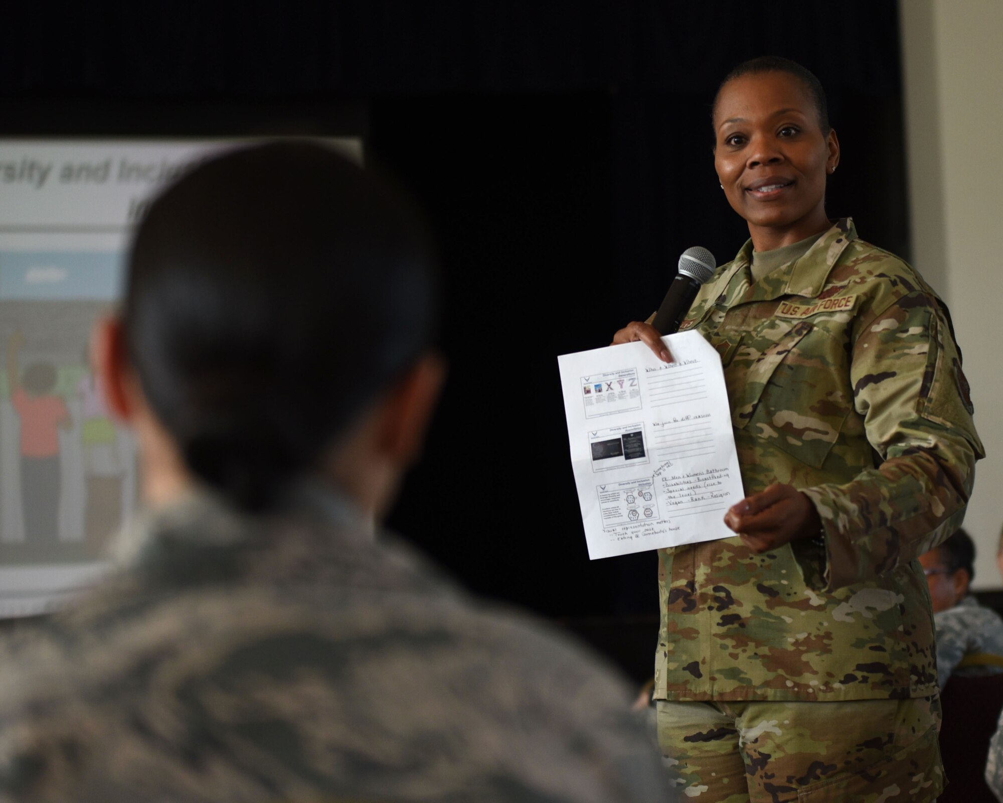 U.S. Air Force Chief Master Sgt. Janna Wesley, Chief of Military Force Management, speaks to a 70th Intelligence, Surveillance and Reconnaissance Wing Airman during a diversity and inclusion briefing at Fort George G. Meade, Maryland, Aug. 6, 2019. Wesley delivered a speech and discussed overcoming barriers, as well as helping Airmen identify unconscious biases. (U.S. Air Force photo by Airman 1st Class Madison Frazier)