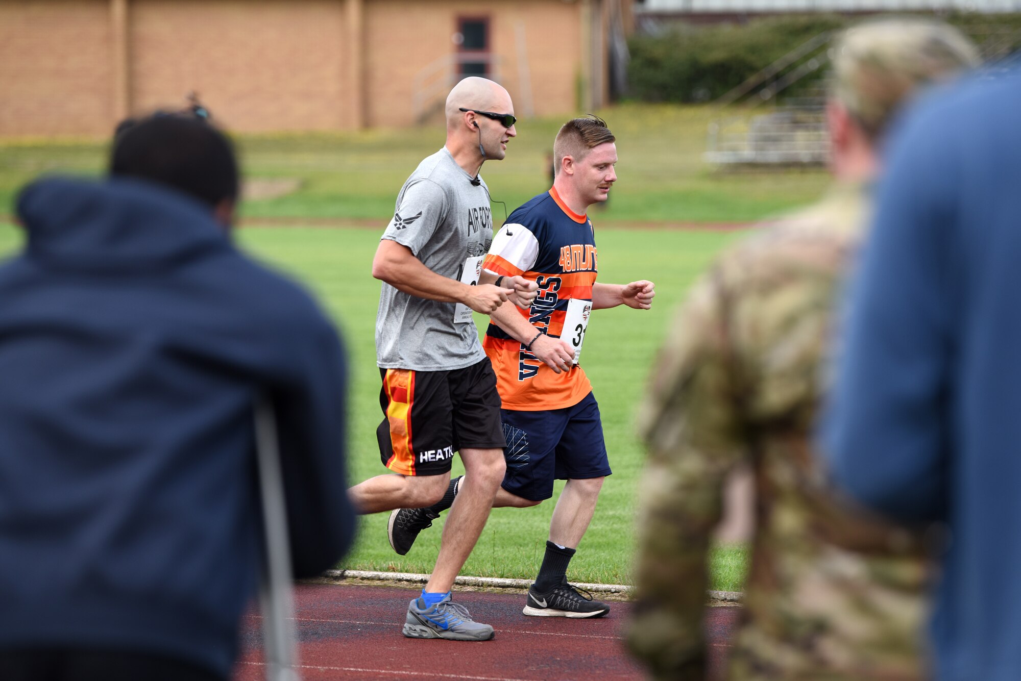 Liberty Wing Airmen run laps to help raise money for Operation Warm Heart at Royal Air Force Lakenheath, England, August 2, 2019. For each lap completed during the event, the runner's sponsors donated money to OWH which provides emergency funds for Airmen in difficult situations.(U.S. Air Force photo by Airman 1st Class Madeline Herzog)