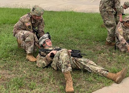 Spc. Matt Oldham, top, takes part in a training exercise with his National Guard unit, C Company, Third Battalion, 144th Infantry Regiment from Seagoville, Texas. Oldham said his Army combat buddy care and lifesaver training helped him successfully pull a driver from a wrecked vehicle on July 24 in downtown Dallas.