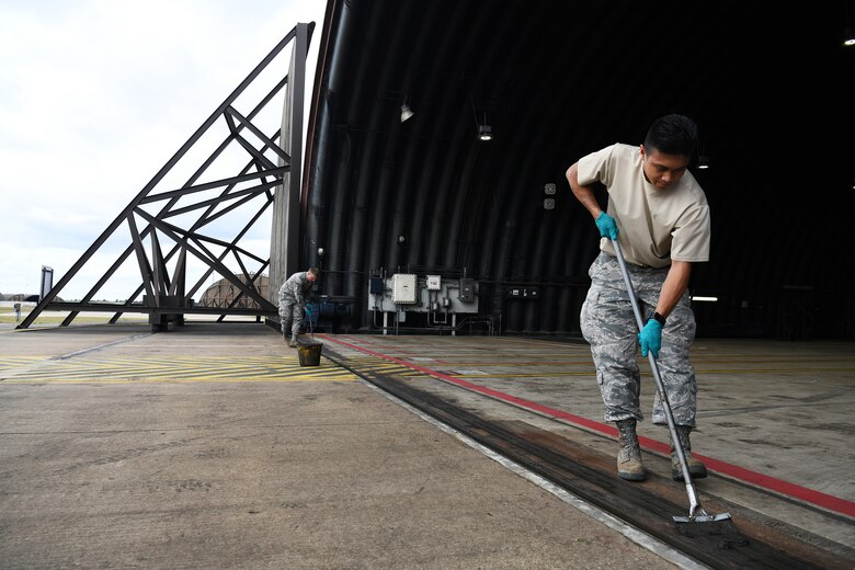 U.S. Air Force Senior Airman Matthew Bonjoe Rosario, 48th Civil Engineer Squadron structural apprentice, prepares a protected aircraft shelter for maintenance at Royal Air Force Lakenheath, England, Aug. 7, 2019.  A PAS is necessary to house aircraft during inclement weather allowing maintenance personnel the ability to service the aircraft through adverse conditions. (U.S. Air Force photo by Airman 1st Class Shanice Williams-Jones)