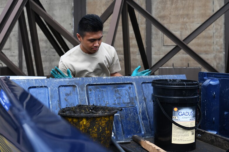 U.S. Air Force Senior Airman Matthew Bonjoe Rosario, 48th Civil Engineer Squadron structural apprentice, closes the tailgate of a truck after completing maintenance on a protected aircraft shelter at Royal Air Force Lakenheath, England, Aug. 7, 2019.  A PAS is necessary to house aircraft during inclement weather allowing maintenance personnel the ability to service the aircraft through adverse conditions. (U.S. Air Force photo by Airman 1st Class Shanice Williams-Jones)