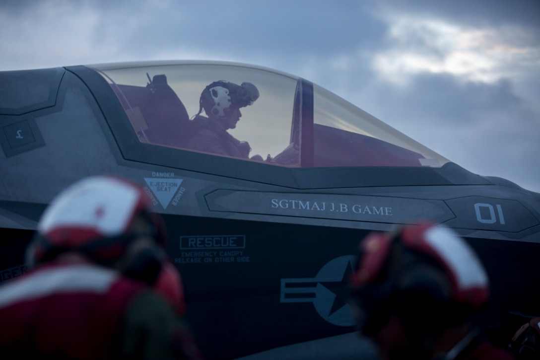 A pilot with Marine Medium Tiltrotor Squadron 265, 31st Marine Expeditionary Unit, waits to take off during an aerial gunnery and ordnance hot-reload exercise aboard the amphibious assault ship USS Wasp, Solomon Sea, August 4, 2019. Wasp, flagship of the Wasp Amphibious Ready Group, with embarked 31st MEU, is operating in the Indo-Pacific region to enhance interoperability with partners and serve as ready-response force for any type of contingency, while simultaneously providing a flexible and lethal crisis response force ready to perform a wide range of military operations.