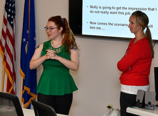 Air Force civilian Madison Muskopf (left) discusses the topic of professionalism in the workplace during an Autism at Work program lunch-in at Wright-Patterson Air Force Base while Molly Fore, program lead, looks on. The Autism at Work program, a collaboration between the AFMC and Wright State University, offers students and recent graduates with a diagnosis on the autism spectrum the opportunity to participate in paid, one-year internships as Air Force civilians.  (U.S. Air Force photo / Darrius A. Parker)